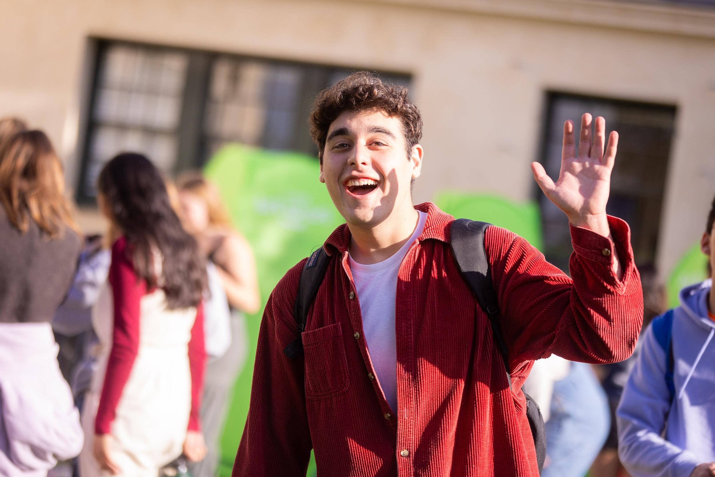 westmont student waving to the camera